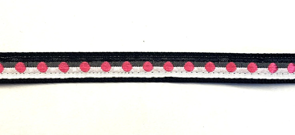 Black and white ribbon with pink dots on black webbing dog collar