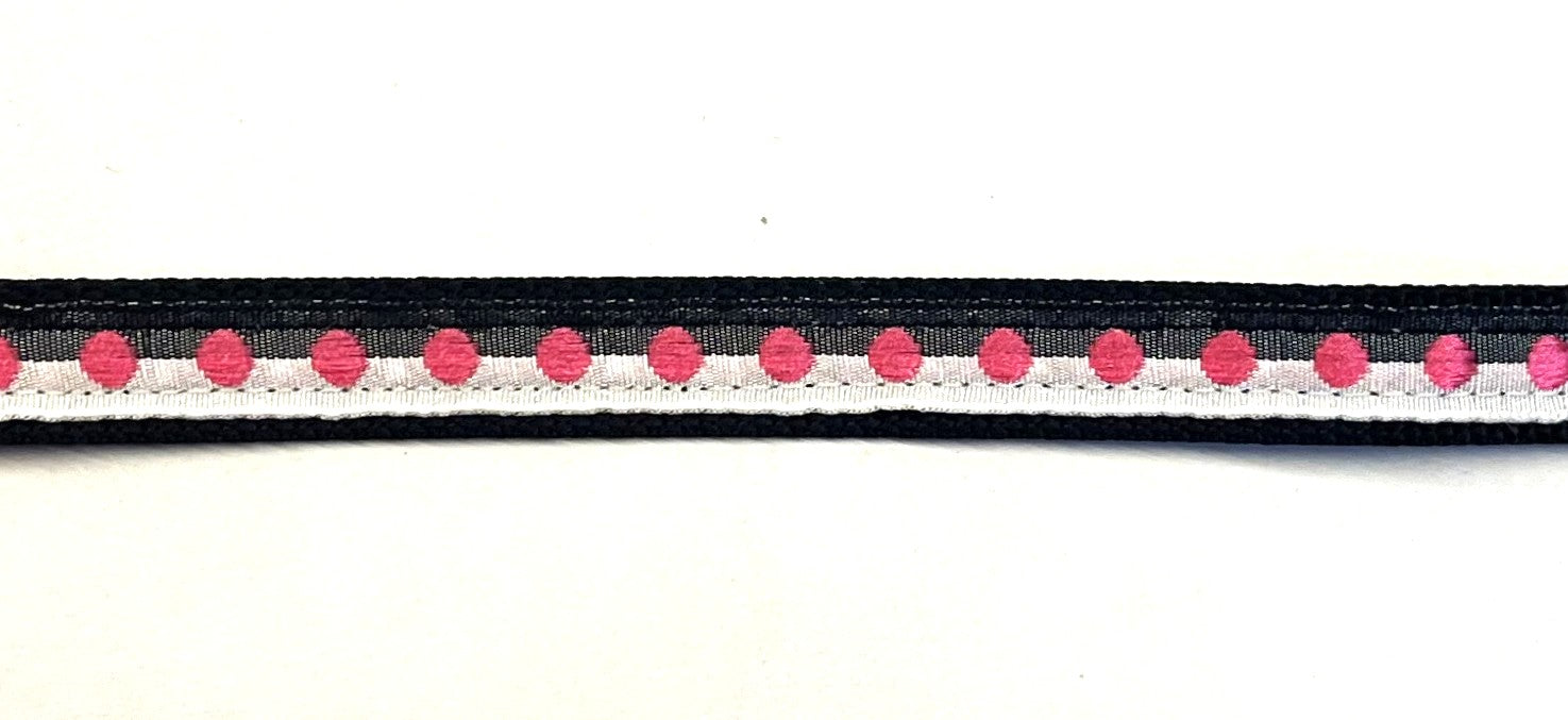 Black and white ribbon with pink dots on black webbing dog collar