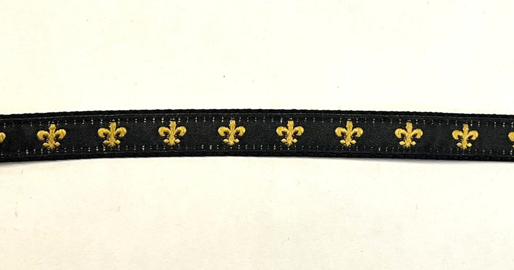 Black webbing dog collar with gold fleur de lis ribbon