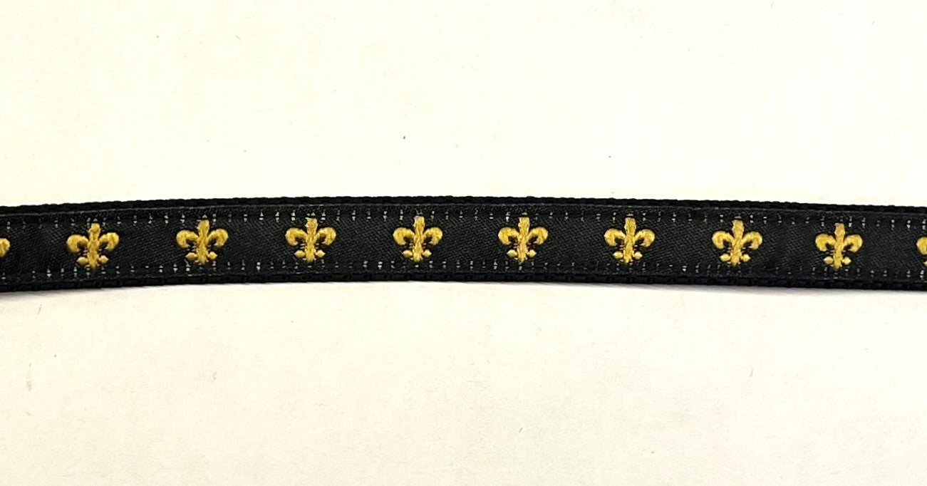 Black webbing dog collar with gold fleur de lis ribbon