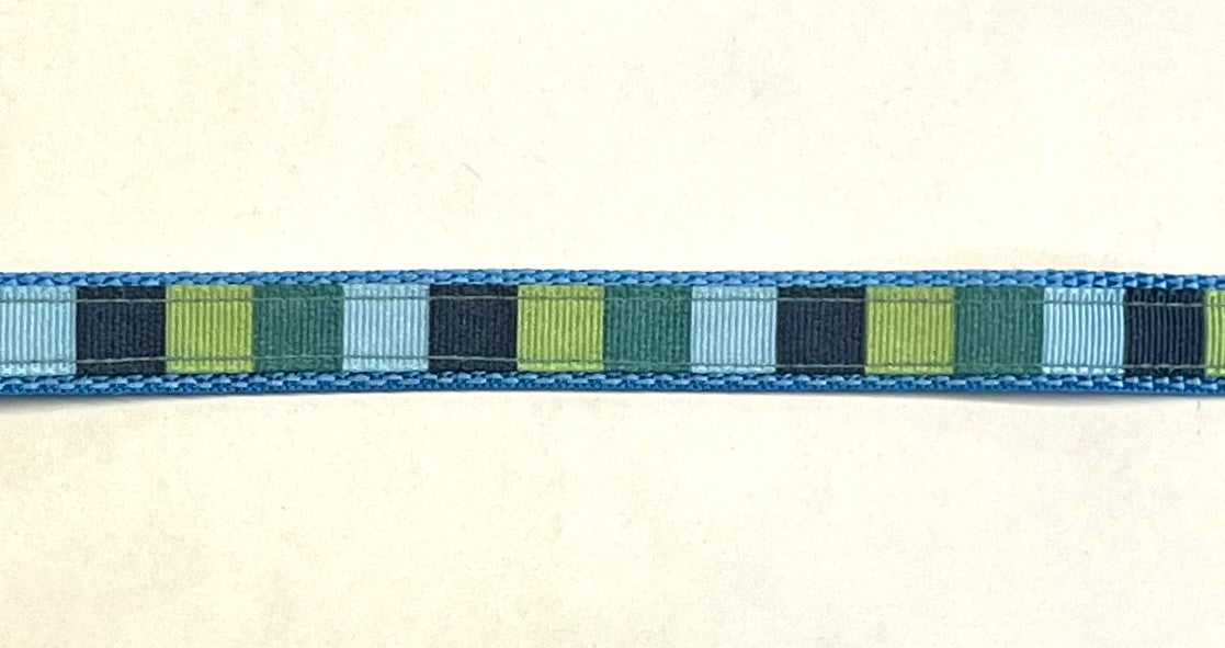 Blue, green, teal, and navy vertical stripe ribbon on light blue webbing dog collar