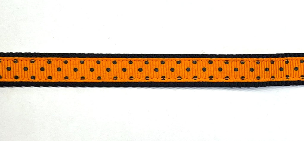 Orange with black polka dots dog collar on black webbing, 1/2 inch width