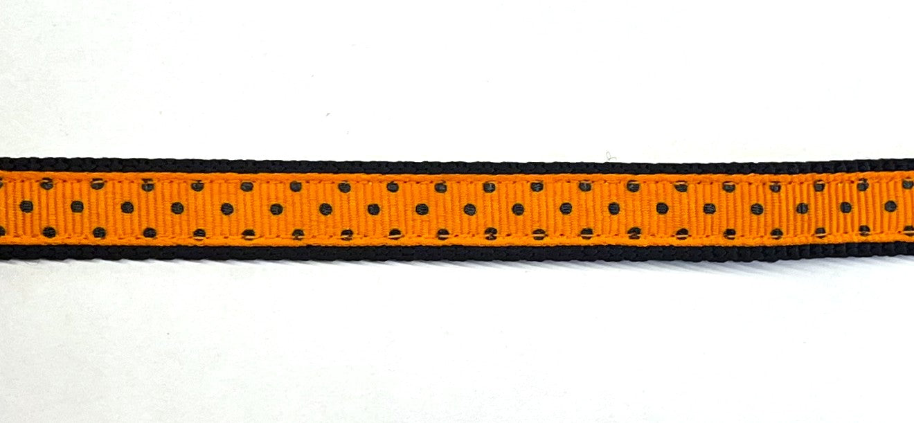 Orange with black polka dots dog collar on black webbing, 1/2 inch width