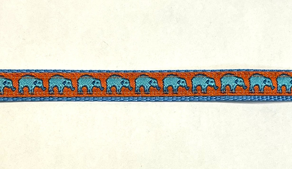 Orange ribbon with turquoise elephants on light blue webbing dog collar