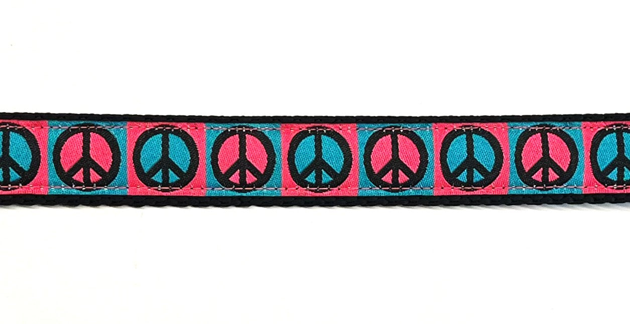 Pink and teal peace signs dog collar 3/4 inch on black webbing