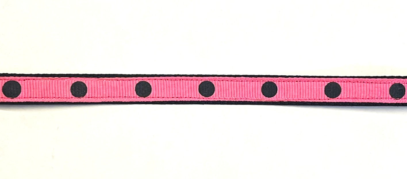 Pink ribbon with black dots on black webbing dog collar