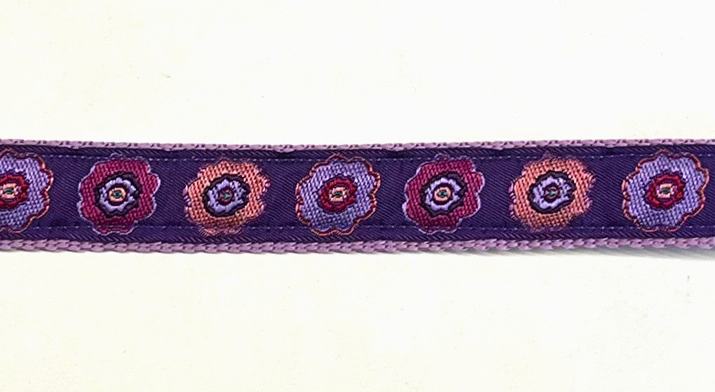 Purple with pink, purple, and lavender flowers dog collar on lavender webbing