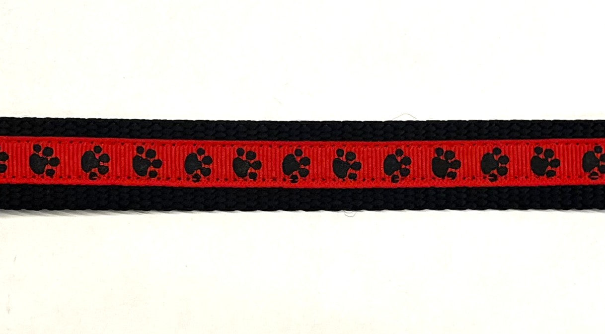 Red with Black Paw Prints Dog Collar 3/4 - red ribbon with black paw prints on black nylon webbing