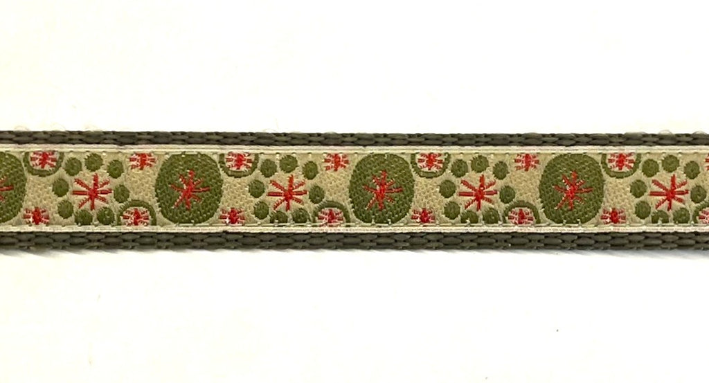 Tan with olive circles and red asterisks design dog collar on olive webbing, 3/4 inch width