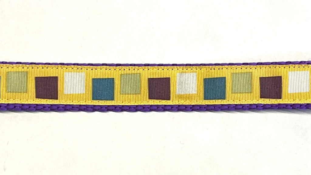 Yellow with teal, purple, olive, and white squares dog collar on purple webbing