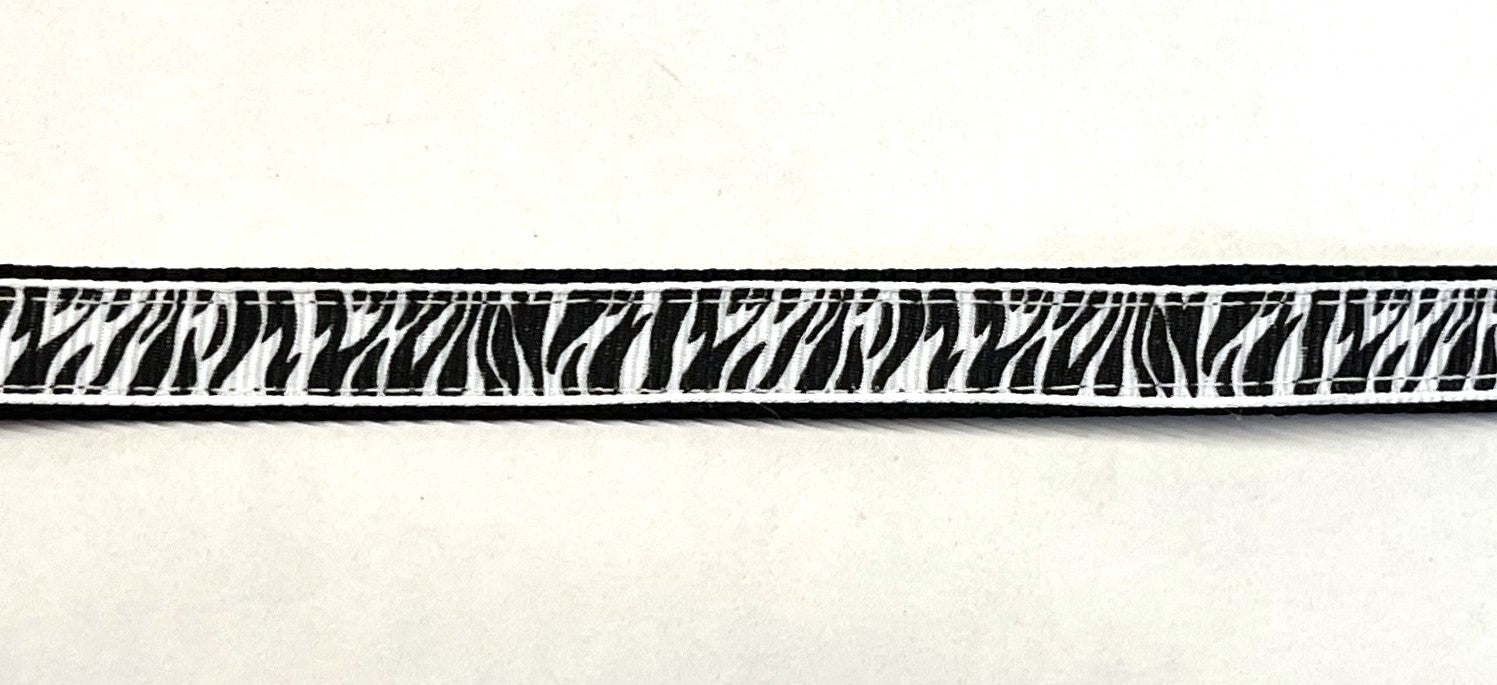 Black webbing dog collar with black and white zebra print ribbon